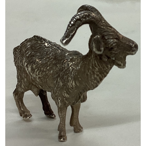 25 - An English silver figure of a goat. Import marked. Marked to antlers. Approx. 43 grams. Est. £60 - £... 