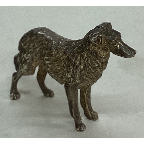 26 - A silver figure of a dog. Approx. 30 grams. Est. £30 - £50.