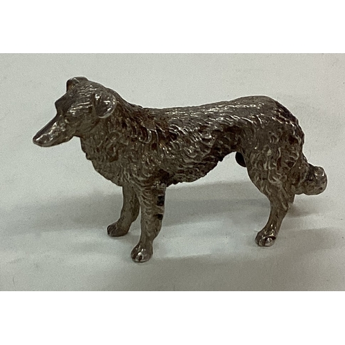 27 - A silver figure of a dog. Approx. 30 grams. Est. £30 - £50.