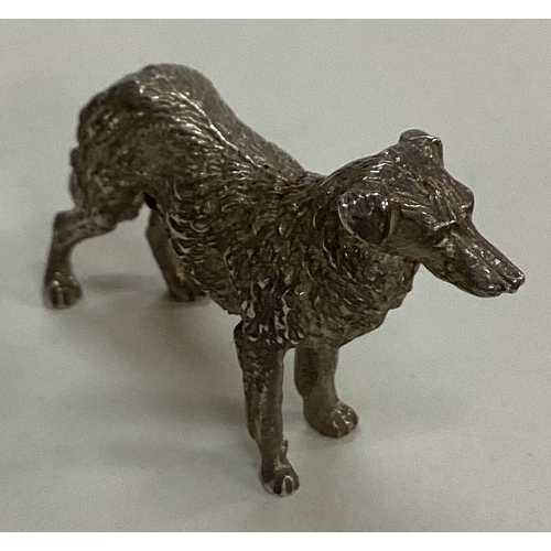 27 - A silver figure of a dog. Approx. 30 grams. Est. £30 - £50.