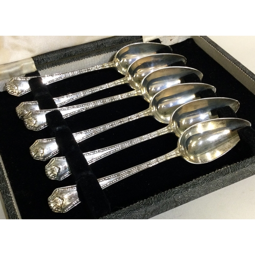 270 - A cased set of six silver grapefruit spoons. Birmingham. Approx. 104 grams. Est. £60 - £80.