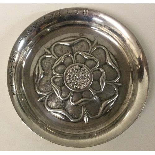 272 - C J VANDER: A silver chased dish. Approx. 40 grams. Est. £40 - £60.q