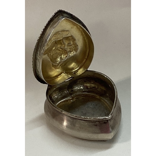 297 - A silver heart shaped hinged box embossed with cherubs. Approx. 26 grams. Est. £30 - £50.