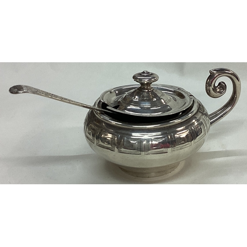 30 - EDINBURGH: A Victorian silver engraved mustard pot and spoon. 1861. By Crichton Brothers. Approx. 14... 