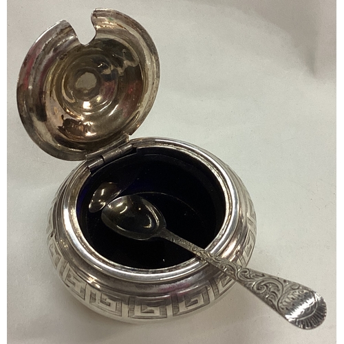 30 - EDINBURGH: A Victorian silver engraved mustard pot and spoon. 1861. By Crichton Brothers. Approx. 14... 