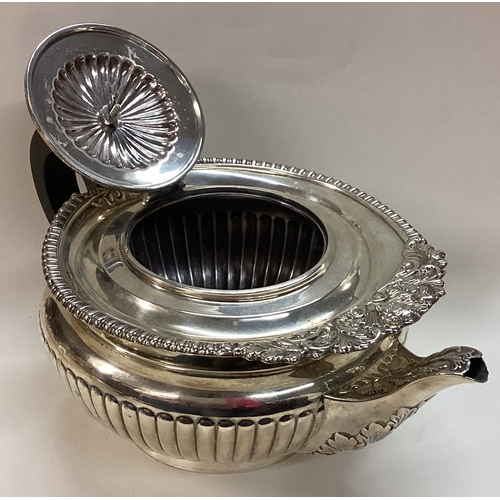 305 - A rare silver teapot embossed with cherubs. London 1896. Approx. 737 grams. Est. £400 - £600.