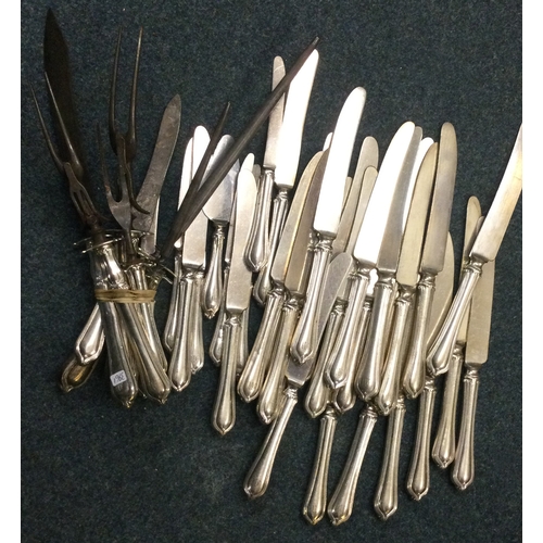 321 - A good American silver carving set together with matching table and dessert knives. Est. £100 - £150... 