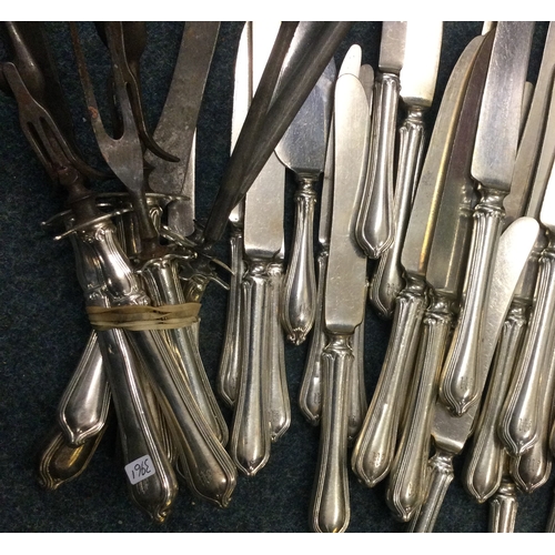 321 - A good American silver carving set together with matching table and dessert knives. Est. £100 - £150... 