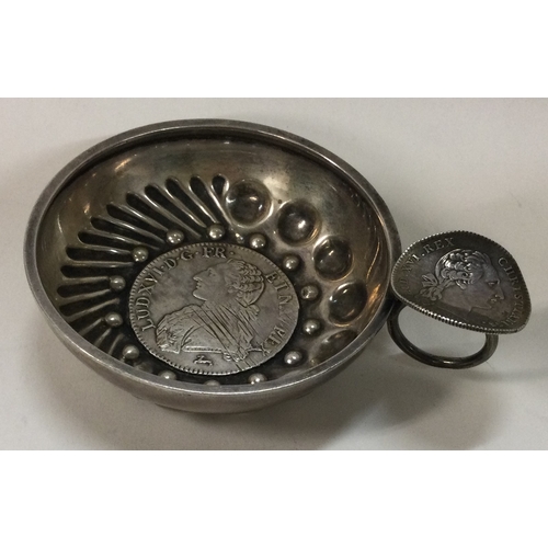 349 - A heavy 19th Century silver wine taster with an 18th Century 1786 coin to centre and coin to handle.... 