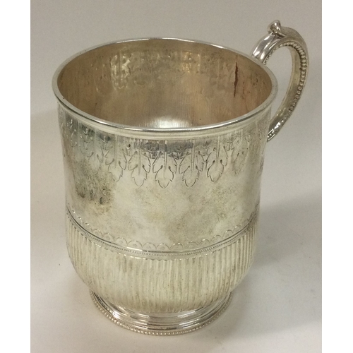 355 - A heavy Victorian silver christening mug. London 1872. By Henry Holland. Approx. 153 grams. Est. £22... 