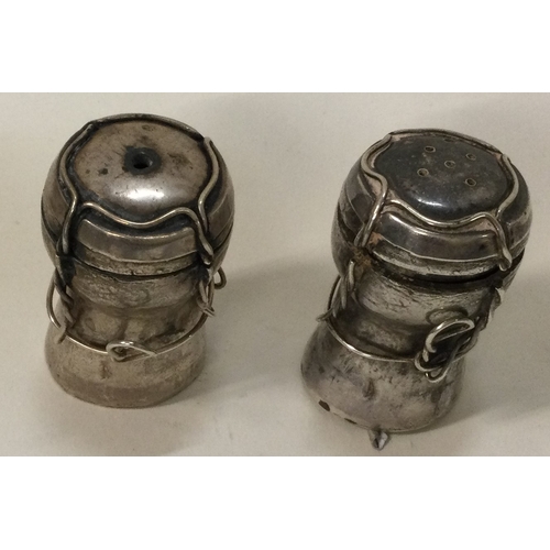 358 - A heavy contemporary silver condiment set comprising of a salt and a pepper pot. London 2002. Approx... 