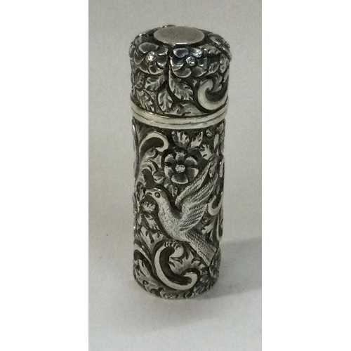 366 - SAMPSON MORDAN AND CO: A Victorian silver chased scent bottle embossed with birds. 1893. Approx. 34 ... 