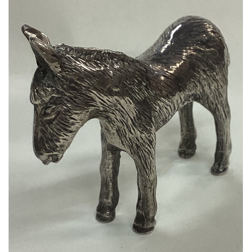 38 - A silver plated figure of a donkey. Marked underneath. Est. £20 - £30.