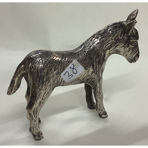 38 - A silver plated figure of a donkey. Marked underneath. Est. £20 - £30.