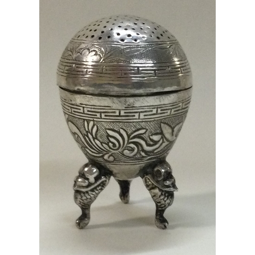 382 - A Chinese export silver pepper on feet with removable lid. Marked to base. Approx. 17 grams. Est. £3... 