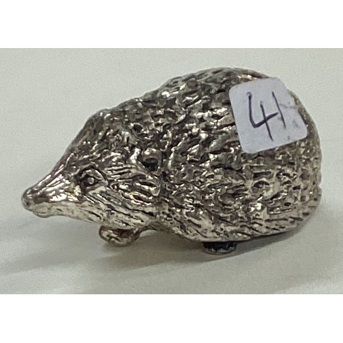 41 - A silver plated figure of a hedgehog. Est. £20 - £30.