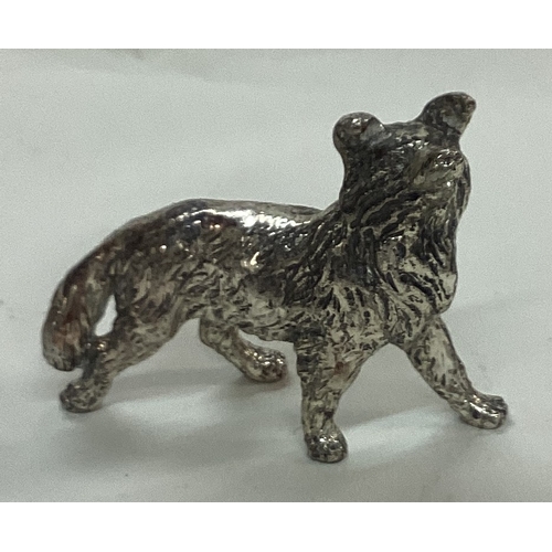 43 - A silver plated figure of an dog. Est. £20 - £30.