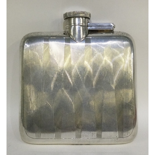 45 - A heavy engine turned silver hip flask with hinged top. Birmingham. Approx. 170 grams. Est. £60 - £8... 