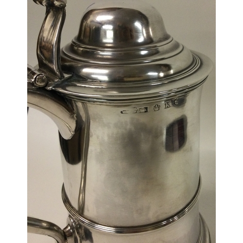 452 - A large heavy Georgian silver lidded tankard of tapering form. Marked to lid and base. Sheffield 180... 