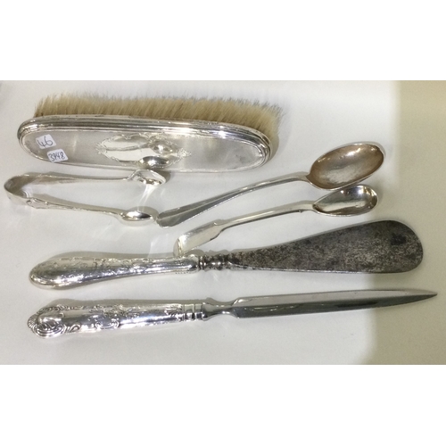 46 - A silver mounted shoe horn together with a brush etc. Approx. 284 grams of gross weight. Est. £30 - ... 