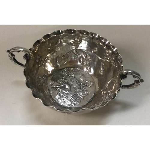 461 - A chased Victorian silver porringer. Import marked. Approx. 26 grams. Est. £30 - £50.