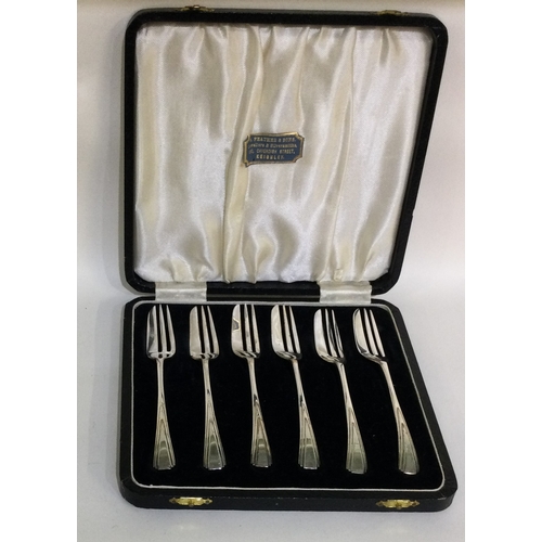 49 - A boxed set of six silver cake forks. Birmingham. Approx. 92 grams. Est. £40 - £60.