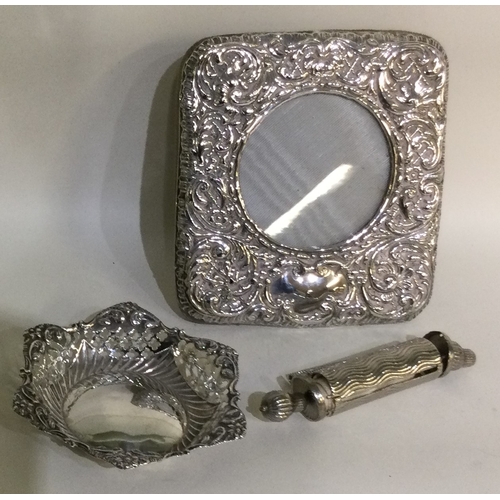 50 - A silver mounted picture frame together with a bon bon dish etc. Approx. 141 grams of gross weight. ... 