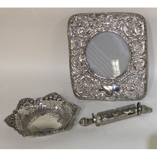 50 - A silver mounted picture frame together with a bon bon dish etc. Approx. 141 grams of gross weight. ... 