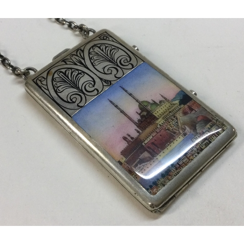 502 - A silver and enamelled compact on suspended chain with scene of a mosque. Approx. 72 grams. Est. £30... 