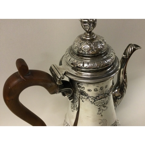 511 - A large 18th Century George III chased silver coffee pot. London 1759. Approx. 872 grams. Est. £800 ... 