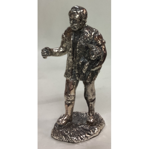 52 - A silver plated figure of a man. Est. £20 - £30.