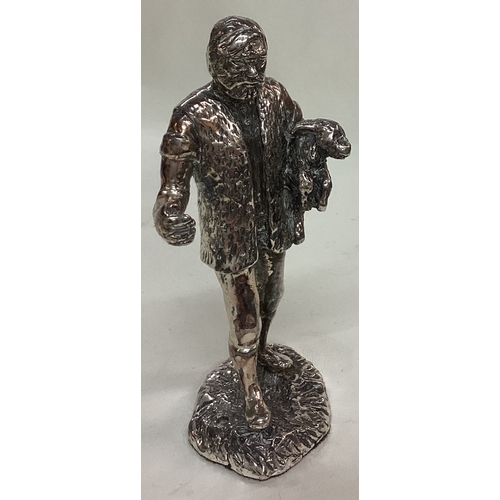 52 - A silver plated figure of a man. Est. £20 - £30.