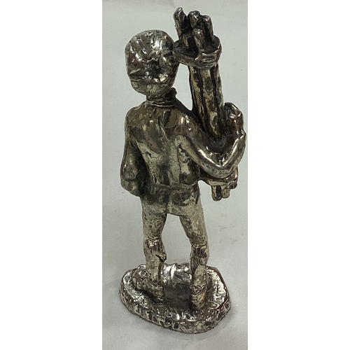 53 - A silver plated figure of a man. Est. £20 - £30.