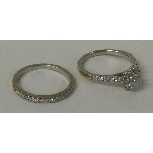 542 - An attractive diamond cluster ring together with matching wedding band in 18 carat gold. Approx. 4.3... 