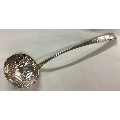 55 - DUBLIN: A fine 18th Century Irish silver engraved soup ladle. Circa 1770. By Michael Keating. Approx... 