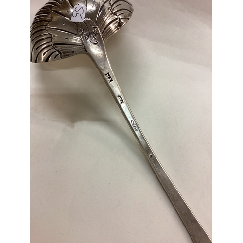 55 - DUBLIN: A fine 18th Century Irish silver engraved soup ladle. Circa 1770. By Michael Keating. Approx... 