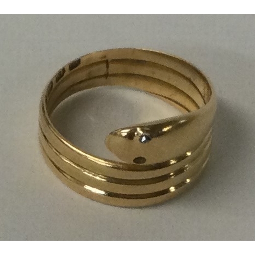 551 - A good Antique 18 carat gold snake ring with diamond eye. Approx. 4.7 grams. Est. £150 - £200.