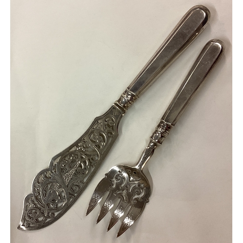 57 - A fine pair of 18th Century Russian silver pierced fish servers. 1895. Approx. 170 grams. Est. £200 ... 