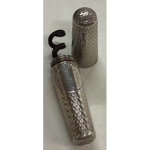 59 - A Victorian silver engine turned silver corkscrew. London 1866. By Thomas Johnson. Approx. 44 grams.... 