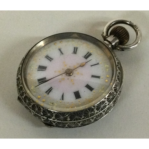 598H - A small silver fob watch with white enamelled dial. Approx. 26 grams. Est. £15 - £20.