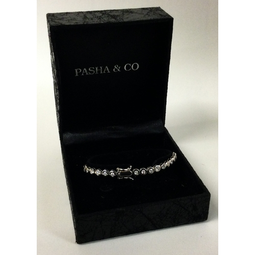 598K - An 18 carat gold diamond mounted line bracelet with concealed clasp. Approx. 16.3 grams. Est. £800 -... 