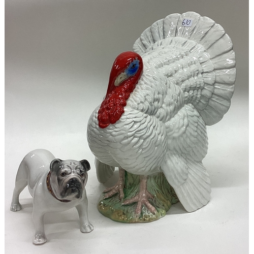 610 - A large Beswick figure of a turkey together with a pottery bulldog. Est. £20 - £30.