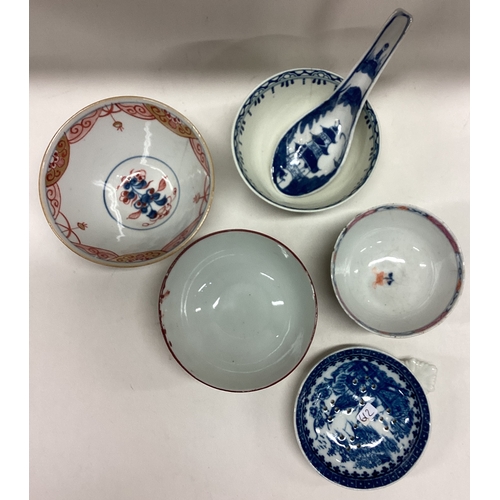 612 - An early English porcelain strainer etc. Est. £20 - £30.