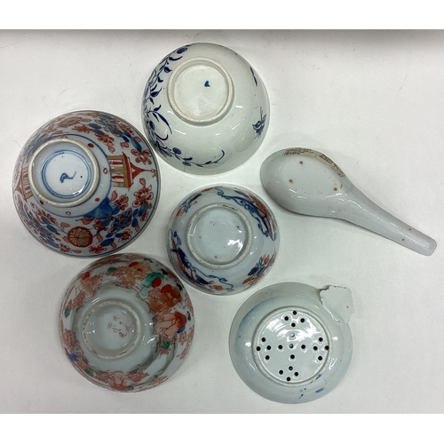 612 - An early English porcelain strainer etc. Est. £20 - £30.