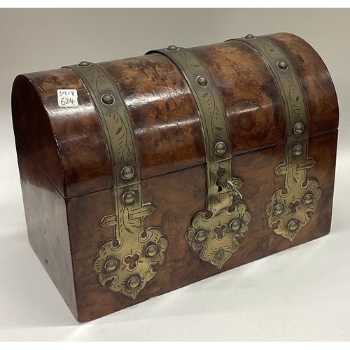 624 - A domed top and brass mounted tea caddy. Est. £20 - £30.