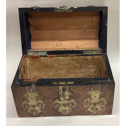 624 - A domed top and brass mounted tea caddy. Est. £20 - £30.