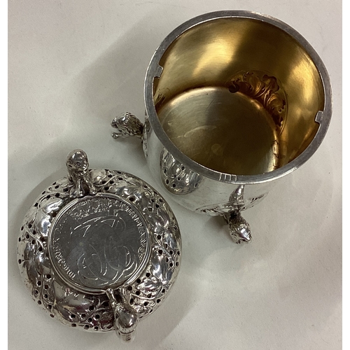 63 - An early 19th Century silver lidded beaker with early coin to centre. Approx. 83 grams. Est. £30 - £... 