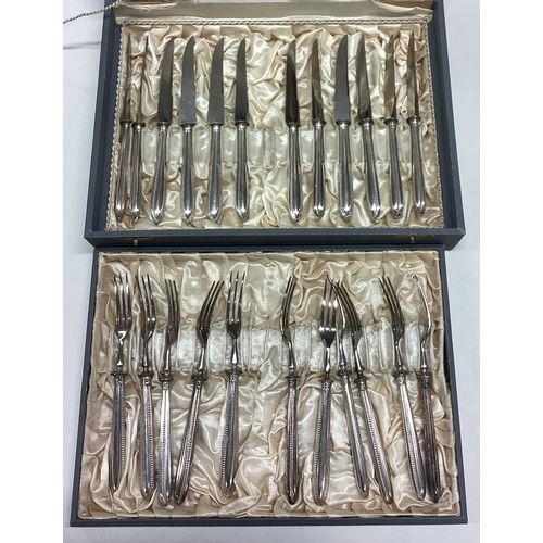 635 - A cased set of ten plus ten dessert knives and forks. Est. £20 - £30.