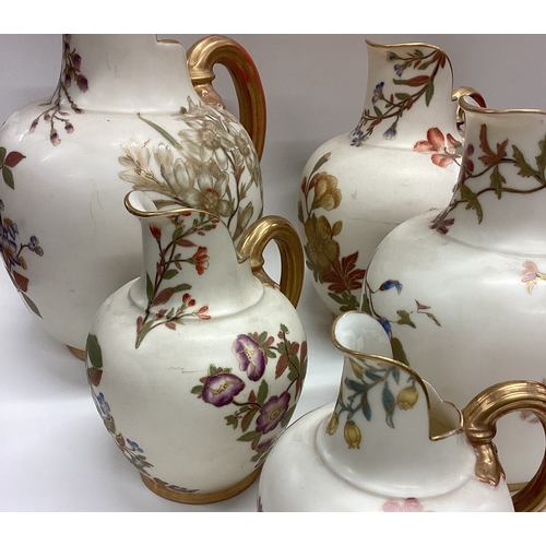 637 - A good set of five Royal Worcester gilt ewers. Est. £80 - £120.