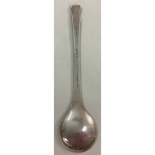 64 - A cased English silver Christmas spoon. By Peter Jackson. Approx. 30 grams. Est. £30 - £50.